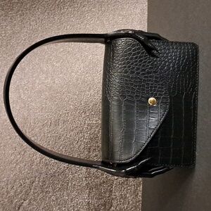 Croc styled black Lady handbag with  hands on each side of handle
